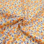 Orange Flowers Polycotton