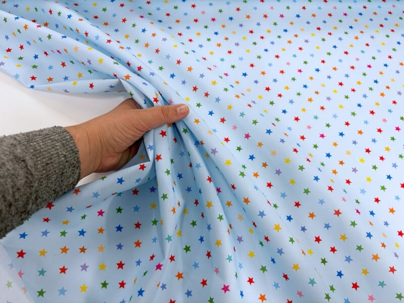 Multicoloured Stars on Blue Polycotton